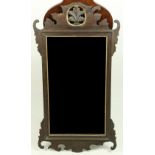 A 19th Century mahogany upright Mirror, with pierced and carved leaf decoration and bevelled mirror,