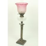 A heavy silver plated Corinthian style Table Oil Lamp, on square stepped base with reeded column and