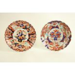 Two similar Japanese Imari pattern Saucer Dishes, each with lobed body and wavy edge, decorated in