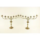 A pair of brass six branch - seven light Altar Candelabra, 17 1/2" x 23" (45cms x 59cms). (2)