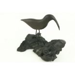 An attractive Irish bog oak Carving, of a Snipe standing on a rustic base, approx. 19cms (7 1/2")