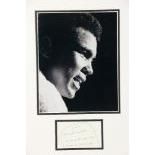 [Ali (Muhammad)] A framed black and white press Photograph of Ali, side profile with towel around