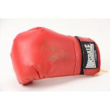 Signed by Evander Holyfield Boxing:  A Lonsdale London Child Boxing Glove, Signed in gold by Evander
