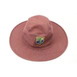 Signed by Brian Lara Cricket: A West Indies purple Sun Hat, with crest Signed in silver pen 'To