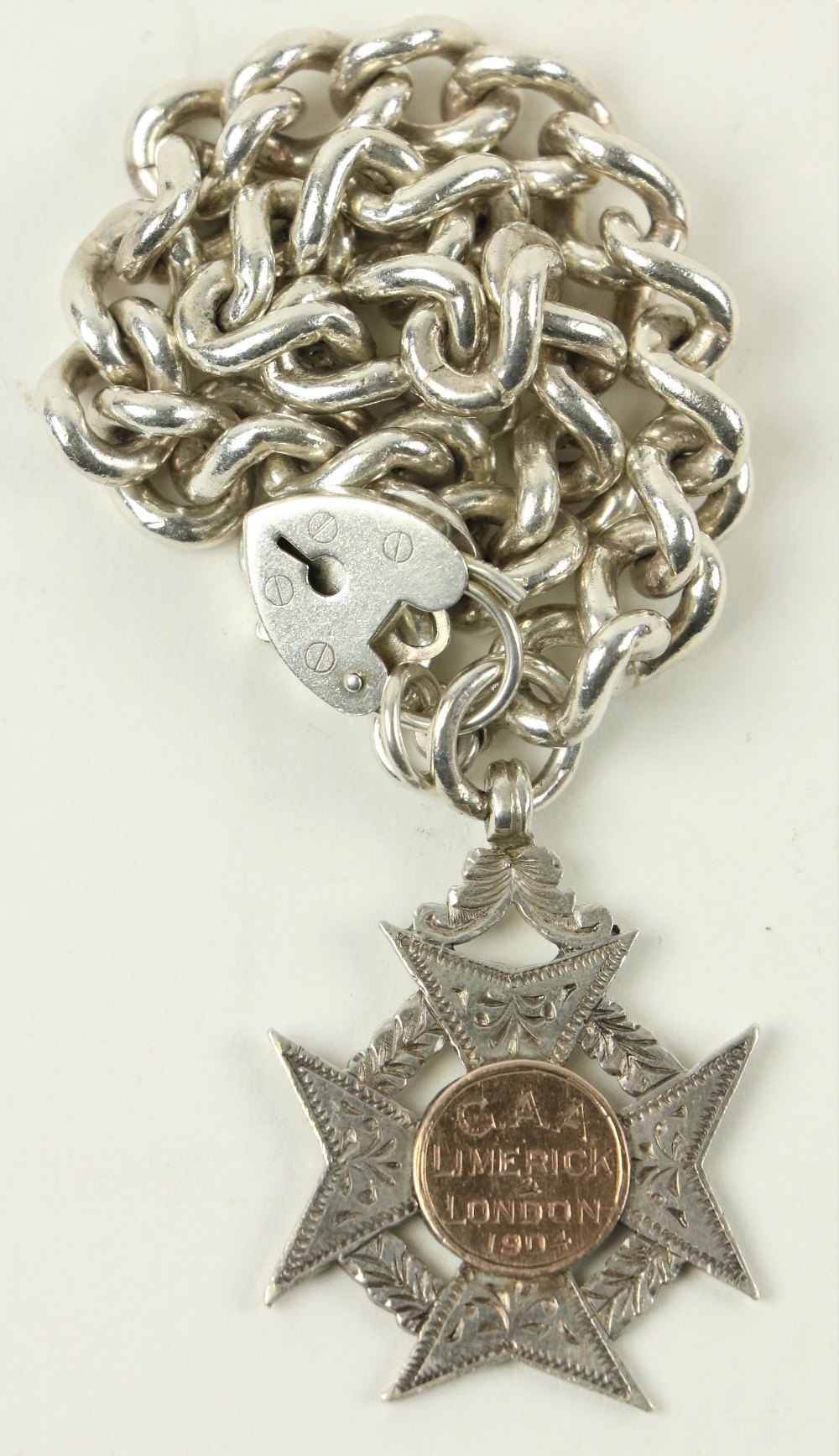 Limerick v. London 1904 Medal: - G.A.A. 1904, An early silver Maltese shaped engraved and pierced