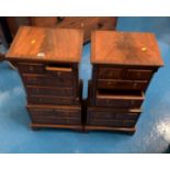 Pair of mahogany cabinets with 8 small drawers each. 15” long x 11” wide x 30” high.