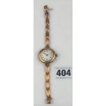 9k gold ladies watch with gold strap, total w: 23.5 gms, not working