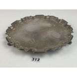 Silver salver with scalloped edges and 3 scroll feet, 10” diameter, w: 17.5 ozt