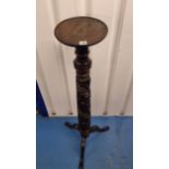 Tall carved mahogany Torchere. 52” high x 10” diameter top.