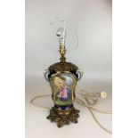 Porcelain and gilt table lamp with painted scenes, 17” to top of fitting