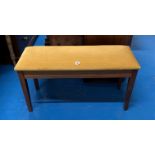 Duette piano stool with upholstered lift up seat. 36” long x 13” wide x 19” high.