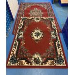 2 x Red patterned rugs. 90” x 63”, 74.5” x 55”