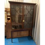 Edwardian china cabinet on tall legs with 2 astrical glass doors, 41” long x 12” deep x 70” high.