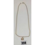 9k gold necklace with round pendant. 19.5” chain, 0.5” pendant, total W: 4.5g