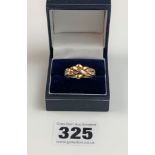 9k gold braided ring. Size V, W: 5g.