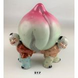 Pottery Longevity Peach held up by 3 Chinese boys 10.5” high