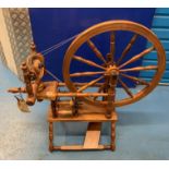 Spinning wheel. Working, 38” long x 34” high.