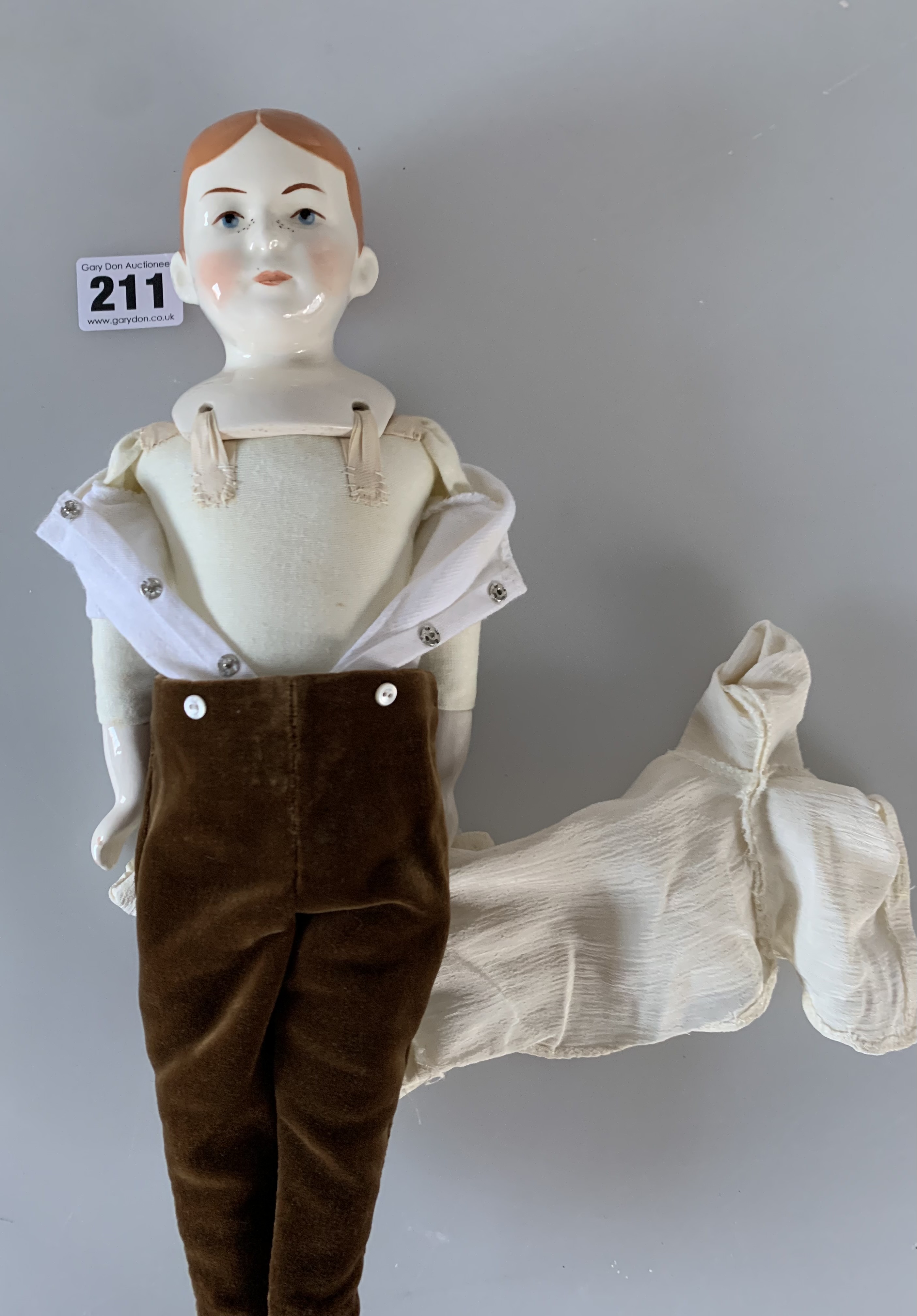 China boy doll dressed in brown velvet trousers, cream shirt, green tie. 13” high - Image 5 of 6