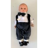 1920’s Composition boy doll. Blue painted moveable eyes with black eyelashes. Moulded hair.