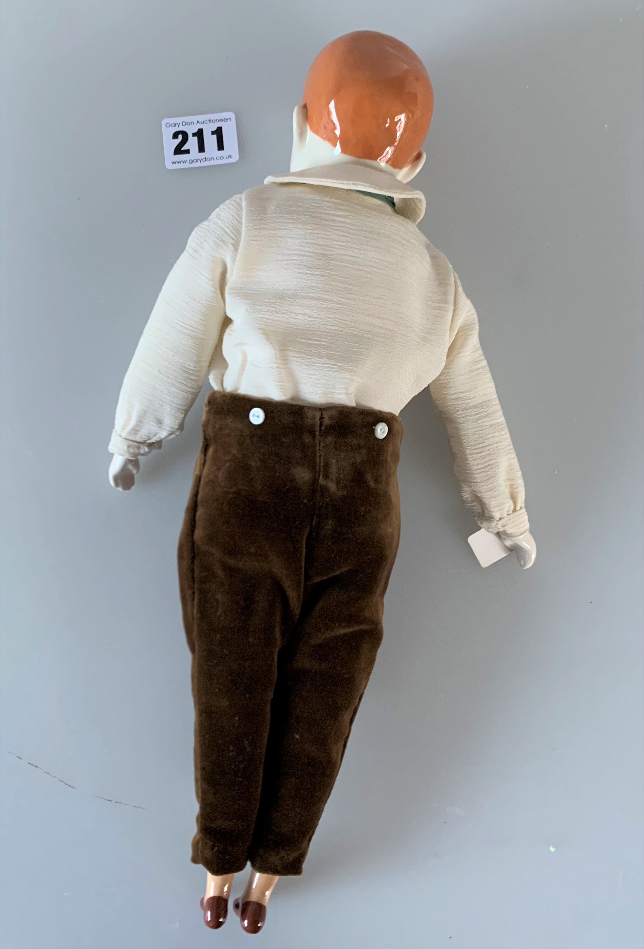 China boy doll dressed in brown velvet trousers, cream shirt, green tie. 13” high - Image 2 of 6