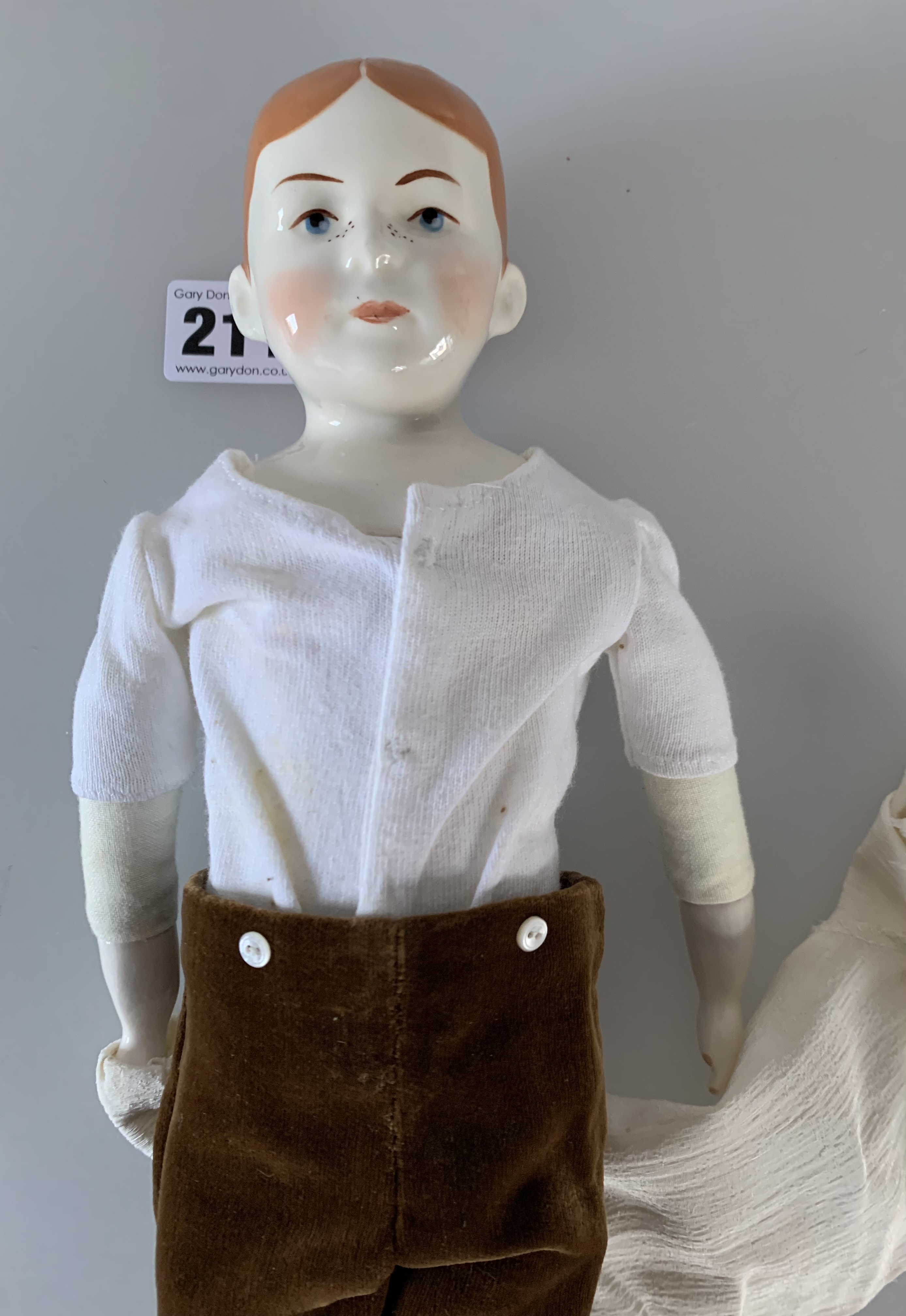 China boy doll dressed in brown velvet trousers, cream shirt, green tie. 13” high - Image 4 of 6