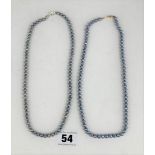 2 blue pearl necklaces with 10k gold clasps, each 16.5” long