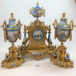 French gilt spelter and Sevres style porcelain three piece clock garniture, clock 18.5” high, urns