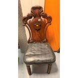 Carved mahogany hall chair with shield back, twist legs and loose leather cushion, 44”h x 18”w x