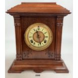 Brass faced wooden 2 hole mantle clock with pendulum and key 15” high x 13” wide