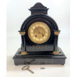 Black painted wooden and brass faced 2 hole mantle clock with pendulum and key 14” high x 12” wide