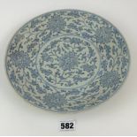 Chinese blue and white dish decorated with flowers around a lotus medallion, base marked with six