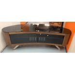 Curved retro style tv/hifi stand with black glass top and 2 opening doors on stainless steel legs,