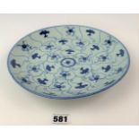 Chinese blue and white dish decorated in concentric bands of floral designs, base marked with four