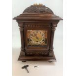 Carved mahogany bracket clock with 3 hole brass face, pendulum and key 20” high x 13” wide