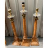 3 tall wooden candleholders 36”h, 34”h and 33”h