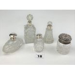 5 assorted glass and silver lidded and banded scent bottles