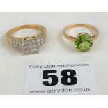 2 x 9k gold dress rings – green stone ring size L, white stone ring size N/O, total w: 5.9 gms