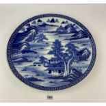 Large oriental blue and white charger decorated with mountains, houses and trees, 18” diameter