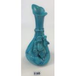 Burmantofts Faience turquoise sculpted vase 10” high, small damage to top