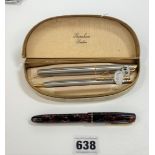 Pair of Waterman Rollerball pens and Burnham red/black fountain pen