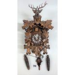 Cuckoo clock with stag head 13” long with pendulum and 2 weights