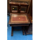 Small writing desk with red leather top and galleried mirrored cupboard doors and pen drawer to