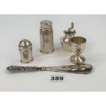 5 small silver items – 2 pepper pots, egg cup, jug and silver handled shoe horn. Total w: 4.6 ozt