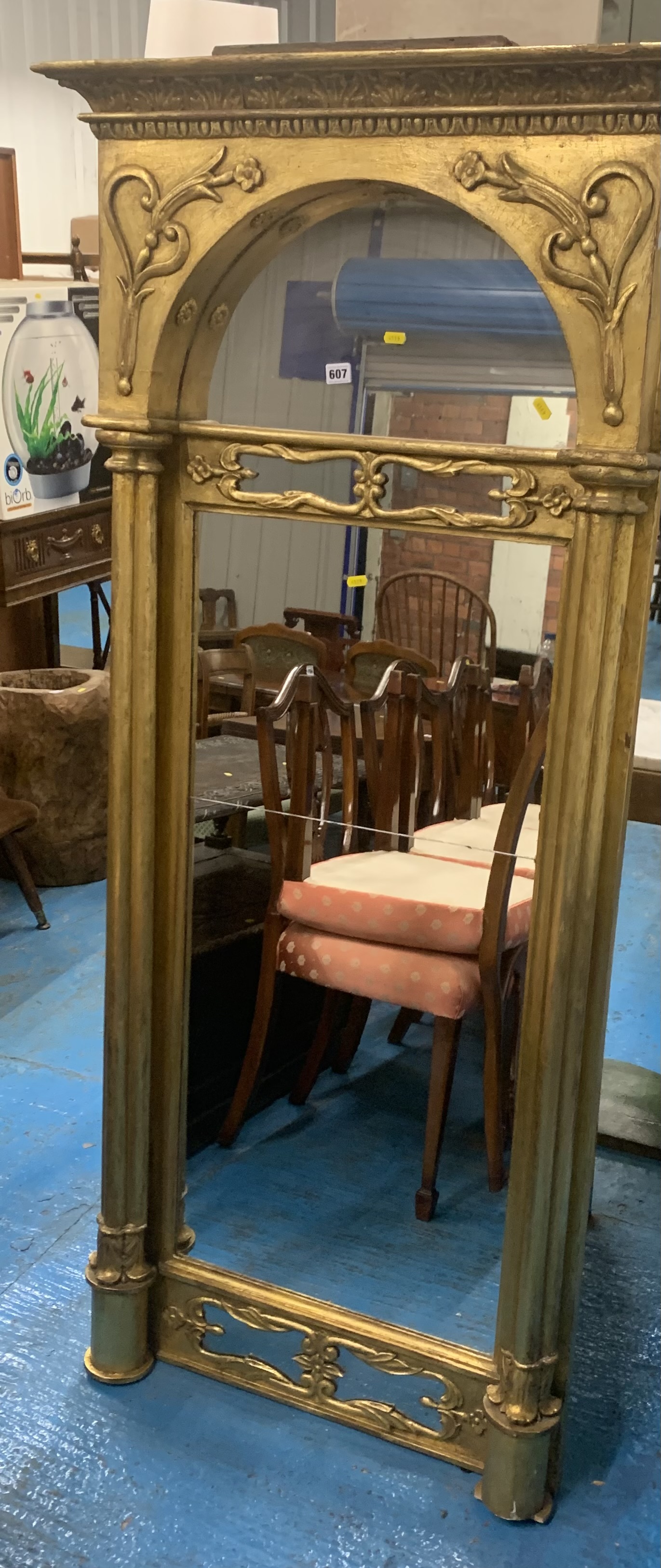 Tall gilt framed pillared wall mirror (made in 2 pieces), 31”w x 68”h. Some paint damage.