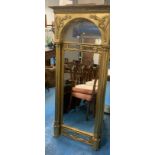 Tall gilt framed pillared wall mirror (made in 2 pieces), 31”w x 68”h. Some paint damage.