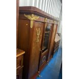 Triple mahogany display cabinet with brass mounts and claw feet, centre glass door and 2 opening