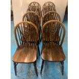 8 dark wood wheelback kitchen chairs, 15”w x 18”d x 35.5”h