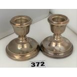 Pair of small silver candlesticks 3” high, weighted bases, total w: 5.4 ozt