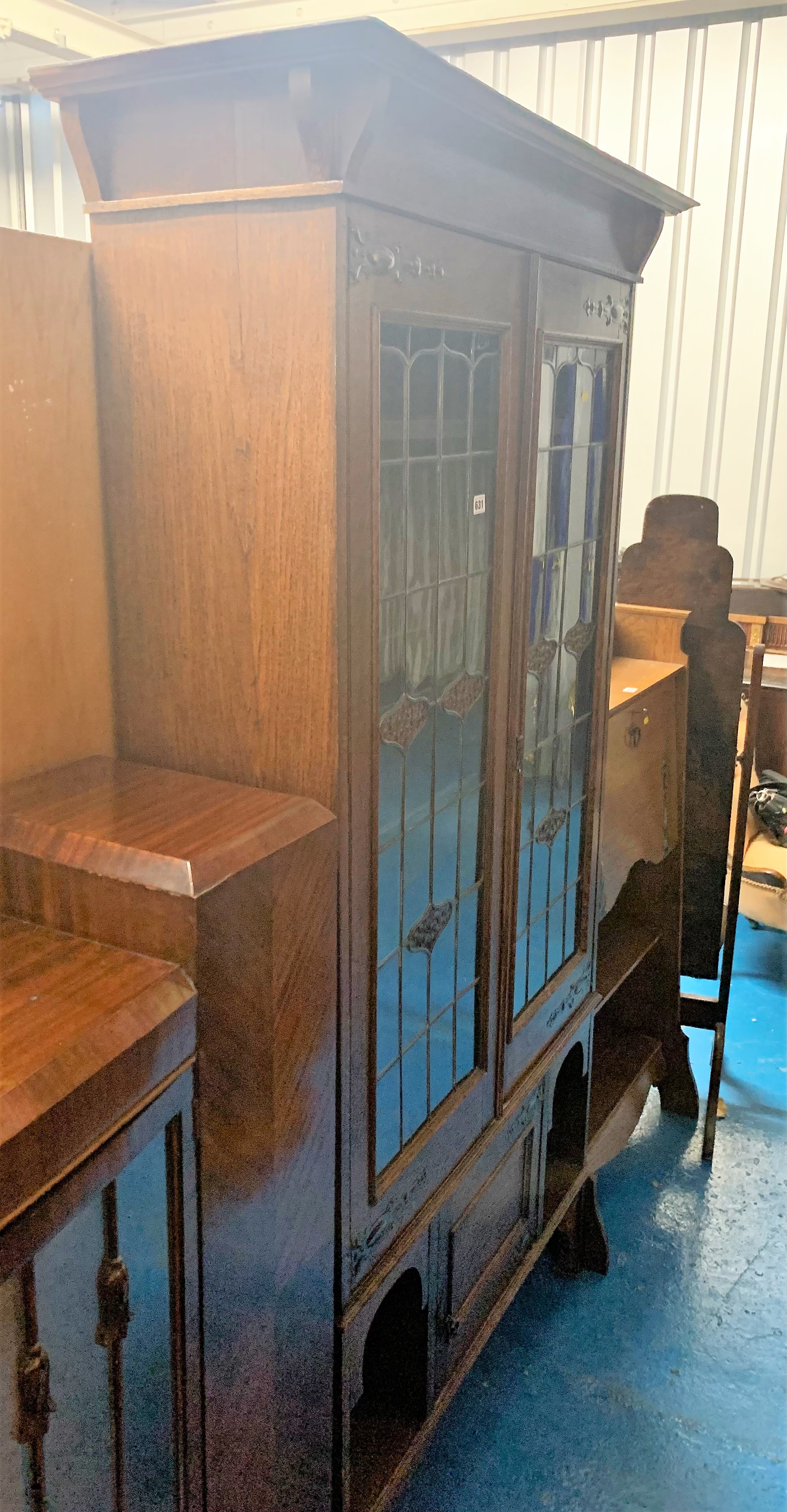 Arts & Crafts leaded light oak display cabinet with copper hinges. Cupboard at bottom. 1 small crack