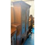 Arts & Crafts leaded light oak display cabinet with copper hinges. Cupboard at bottom. 1 small crack